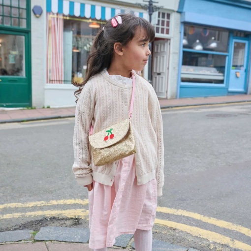 Rockahula glitter crossbody bag with cherry design.