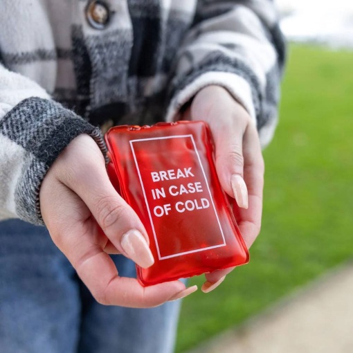 Hand warmer with "Break in Case of Cold" design.
