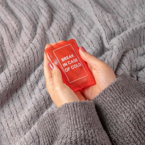 Hand warmer with "Break in Case of Cold" design.